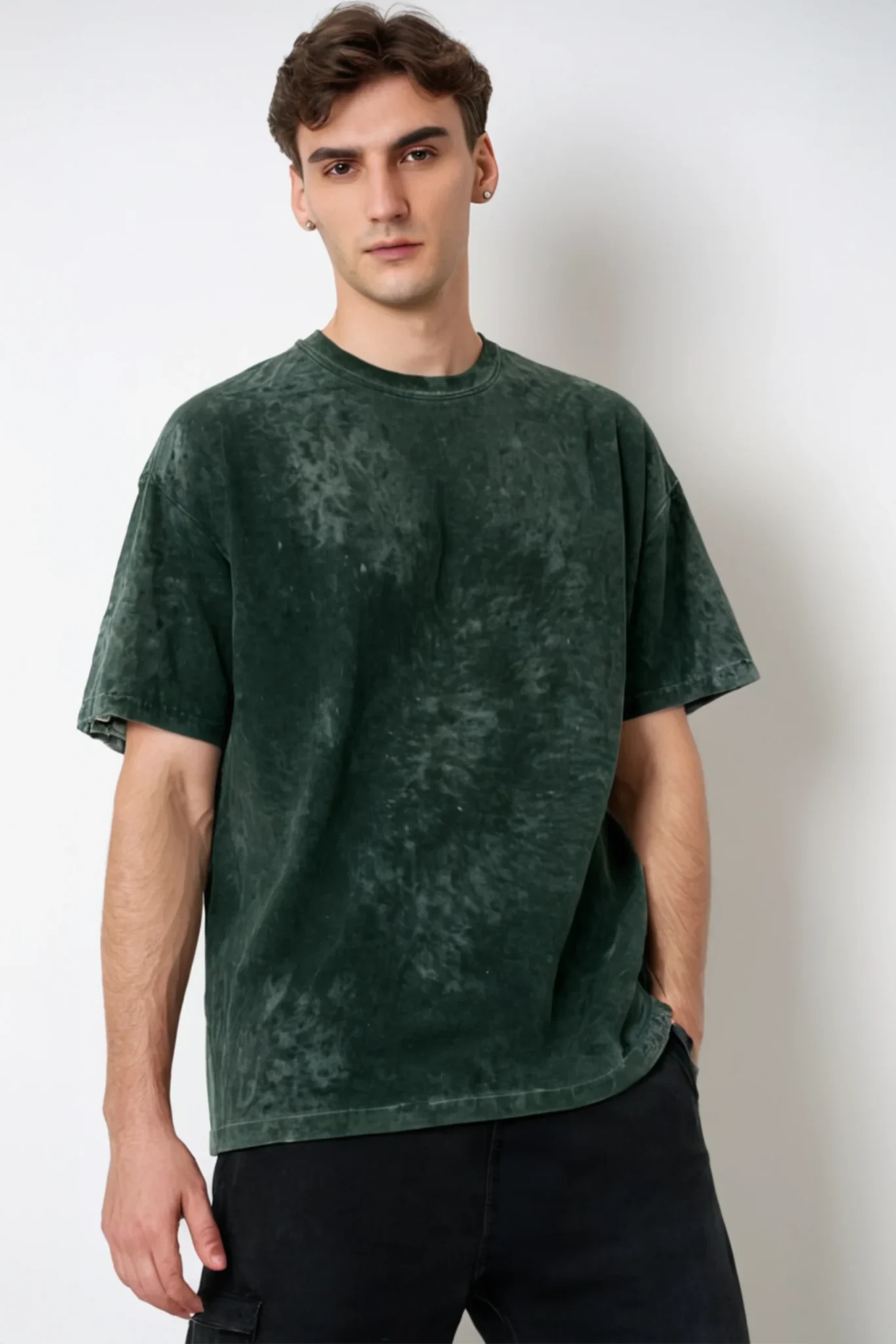 A men’s solid green acid wash oversized T-shirt with a vintage-inspired design, ideal for casual and streetwear fashion.