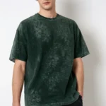 A men’s solid green acid wash oversized T-shirt with a vintage-inspired design, ideal for casual and streetwear fashion.