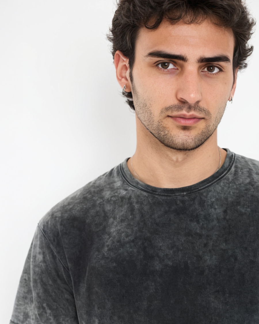 A solid black acid wash oversized T-shirt with a trendy and vintage-inspired look, ideal for casual and streetwear fashion.